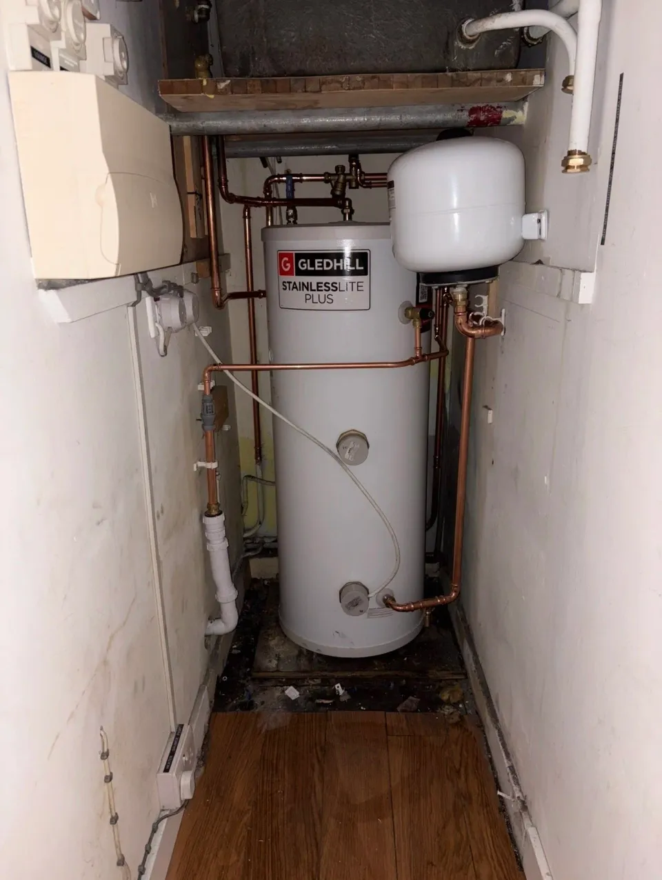 Gledhill cylinder and expansion vessel fitted in a cupboard alongside an existing boiler