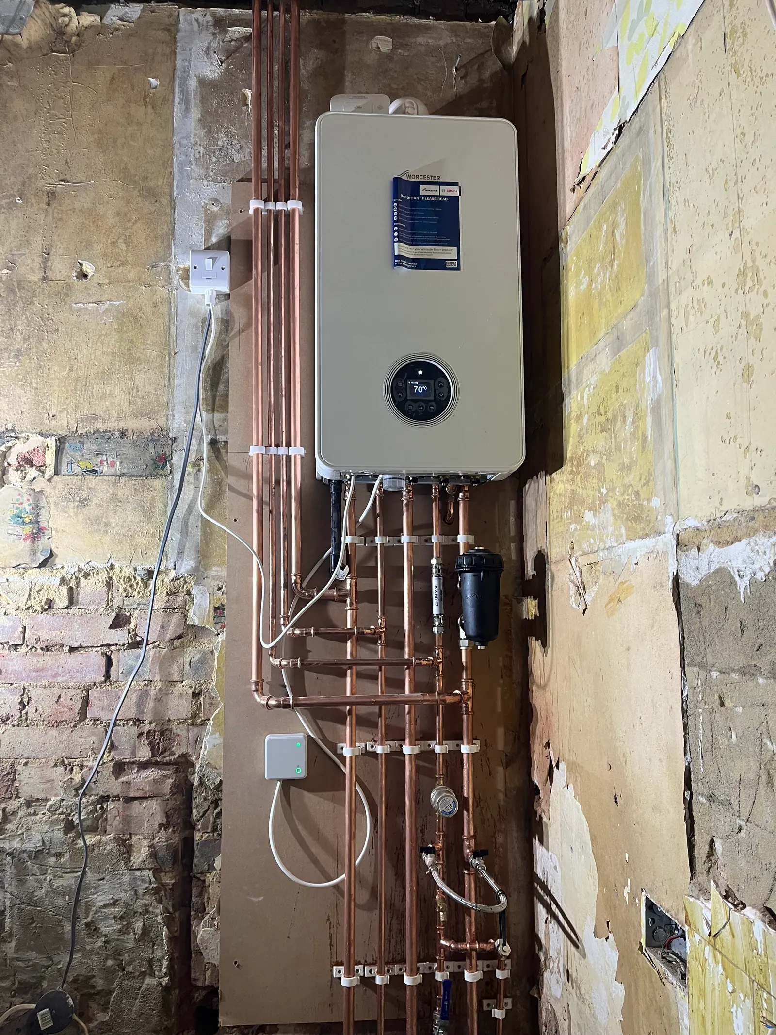 Worcester boiler with exposed copper heating pipework from Pureflo's own work